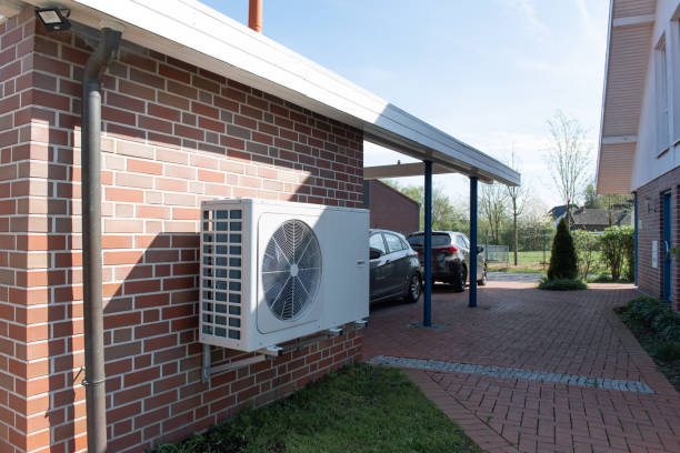 Air Source heat pump fitted outside a new home development stock photo