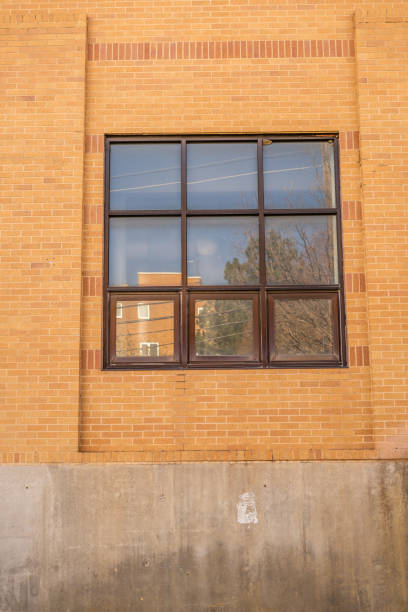 istock Reflective Windows Glass Panes Brick Wall Squares 2150884323