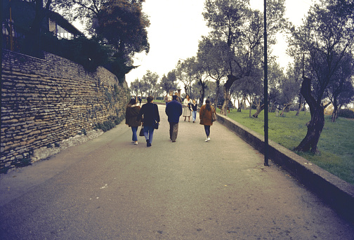 Sirmione, Lombardy, Italy, 31 October 1993: along via Caio Valerio Catullo tourists reach the tip of the peninsula overlooking Lake Garda after visiting the Scaliger castle
