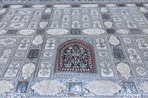 Beautiful walls of the Interior of Amber Fort are decorated and ornate, adorned with mirrors and floral patterns