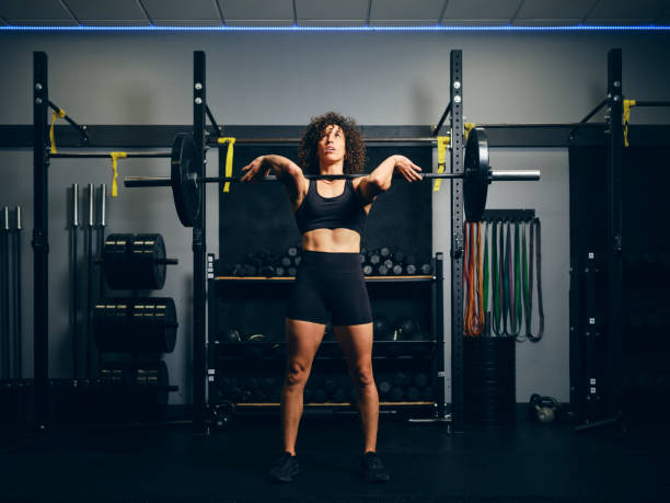 istock Woman Weight Training in a Gym 2150885938