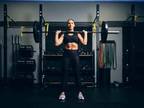 istock Woman Weight Training in a Gym 2150885988