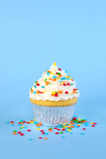 istock Single iced cupcake with colorful sprinkles 2150887045