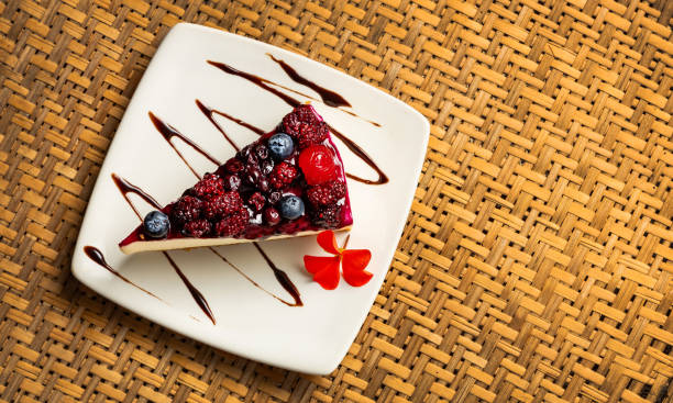 Dessert served with three leches with red fruits - Blackberries, cherries, strawberries, blueberries and red plums