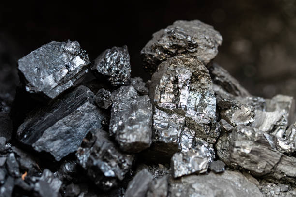istock black coal for heating. Black charcoal texture background. Close-up 2150890067