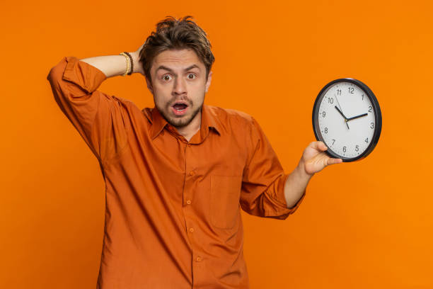 istock Caucasian man with anxiety checking time on clock, running late to work, being in delay, deadline 2150890198