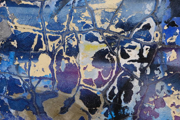 Cracks on the surface of painted concrete. Peeled paint. Neglect of maintenance.