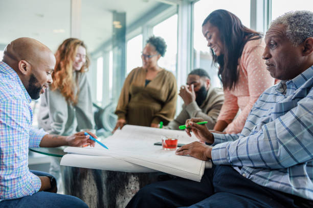 istock Discussion among coworkers from different races about a working project. 2150892011