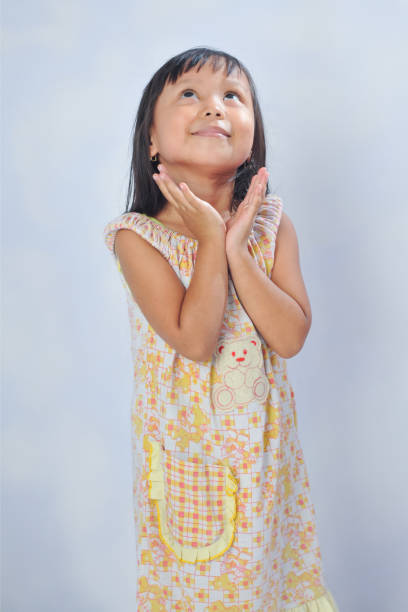 istock an Indonesian little girl with curiousity pose 2150892424