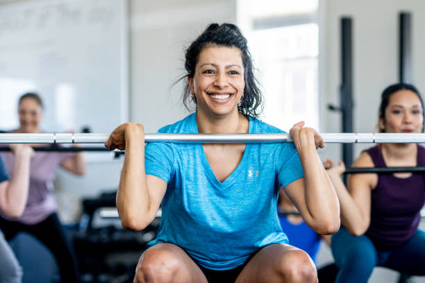 istock Women Weight Lifting 2150895625