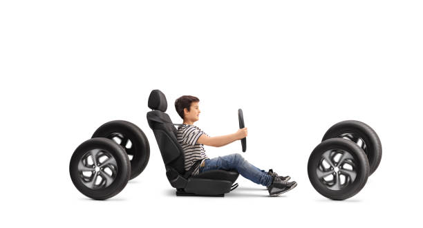 istock Boy sitting in a ca seat and holding a steering wheel 2150895947