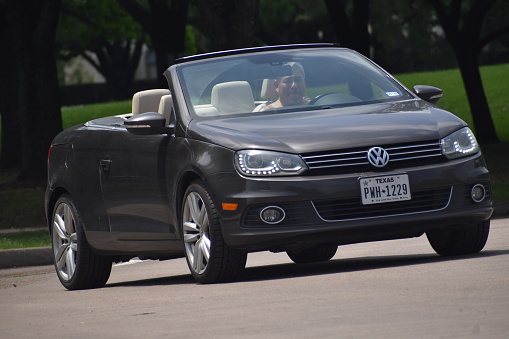 Houston, TX USA 14-29-2023 - A portrait of a Volkswagen EOS cruising near Herman Park in Houston