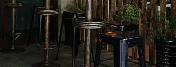Rows of modern chairs lined up and table near window