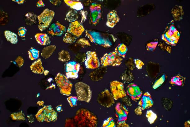 Colorful sand grains from San Luis Obispo, California, spread over the slide on a microscope, with polarization at 40x magnification.