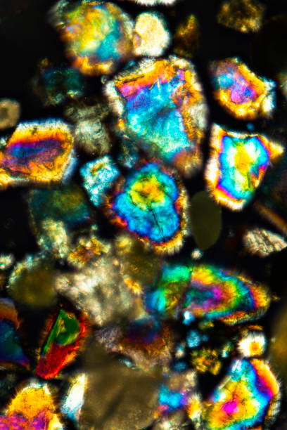 istock Brilliant, glowing grains of sand from California under the microscope. 2150906047