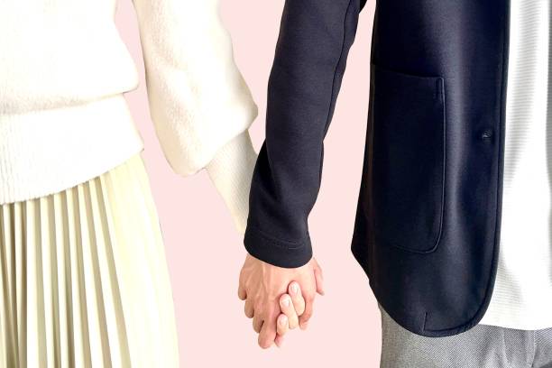 Man and woman holding hands