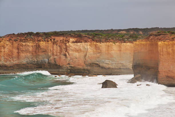 Moody split-toned image of the rugged coastline and turquoise sea at Port Campbell, Victoria, along Australia's iconic Great Ocean Road.