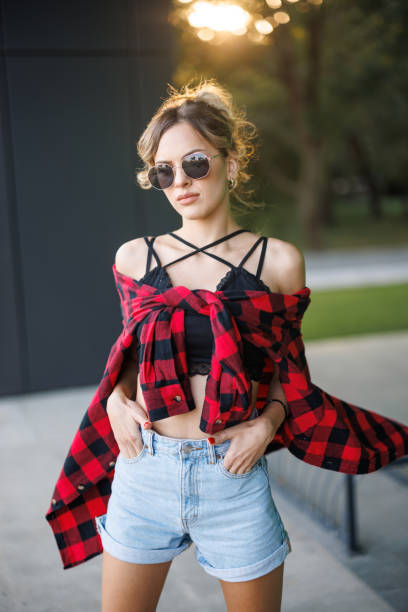 lifestyle, fashion and people concept: beautiful curly woman wearing casual clothes, posing on white background