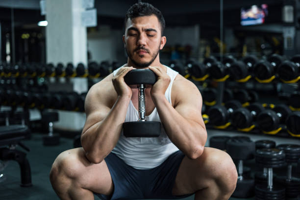 istock body builder is doing leg exercise with dumbell at gym horizontal sport still 2150918265