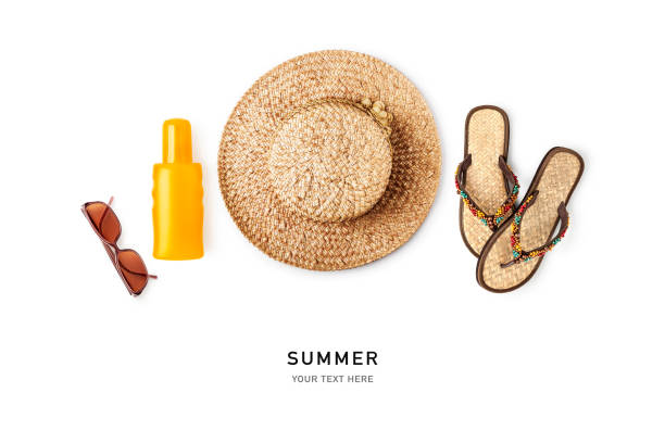 Straw hat, sunglasses, flip flop, sunscreen isolated on white background