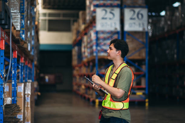 istock Warehouse worker working and checking the stock in the warehouse. .Factory manager using digital tablet check barcode in industry factory logistic. 2150919098