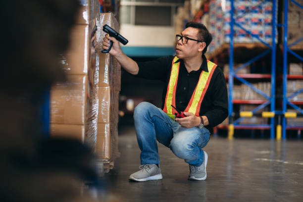 istock Warehouse worker working and checking the stock in the warehouse. .Factory manager using digital tablet check barcode in industry factory logistic. 2150919122