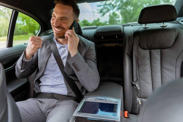 istock Professional businessman enjoying a conversation on his smartphone during a comfortable car ride 2150919192