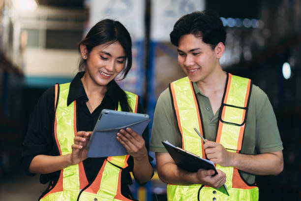 istock Warehouse worker working and checking the stock in the warehouse. .Factory manager using digital tablet check barcode in industry factory logistic. 2150919197