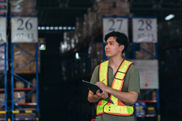 istock Warehouse worker working and checking the stock in the warehouse. .Factory manager using digital tablet check barcode in industry factory logistic. 2150919278
