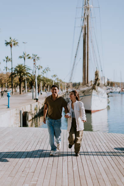 istock Serene stroll along Barcelona marina at with vintage sailing vessel 2150919343