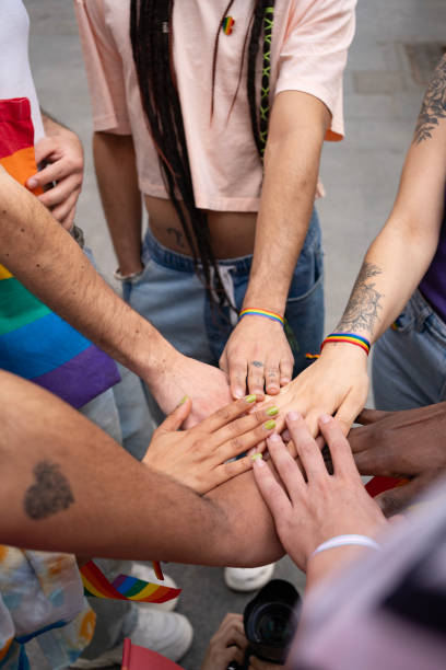 istock LGBT embrace and greet each other at the parade.Side view 2150919537