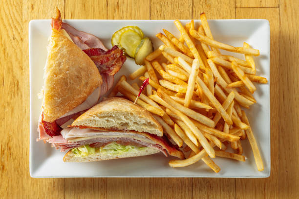 photograph of a sandwich and fries