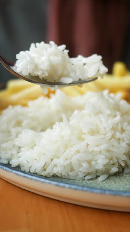 fork pick cooked white rice
