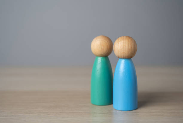 istock Friendly relations. Two human figures stand together. Cooperation and collaboration. A meeting. Communication and discussion. Make friends. A team 2150921460