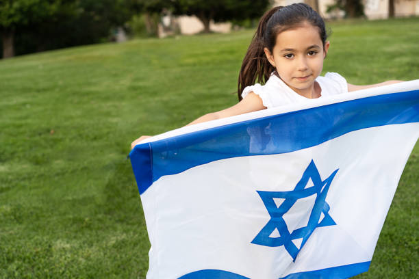 istock Young girl running with Israel flag. 2150922447