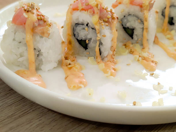 istock Sushi rolls with mayonnaise sauce served in white plate 2150923439