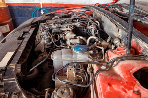 istock Dusty Red Car in Garage for Repair 2150924580