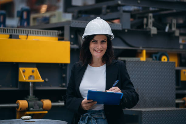 istock Industrial worker inspecting and check up machine at factory machines. Technician working in metal sheet at industry. Foreman checking Material or Machine. 2150925310