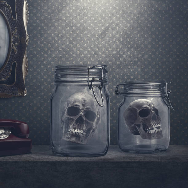 Creepy human skulls in jars, decorations in a dark horror house