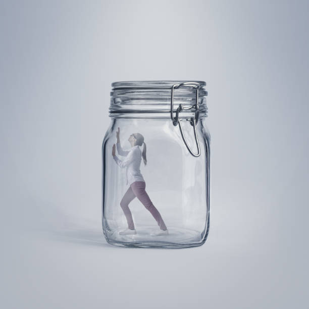 istock Scared woman trapped in a glass jar 2150927663