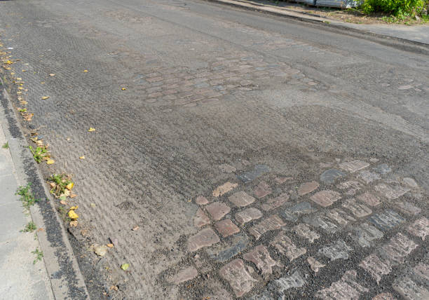 Historical Stone Pavement under Asphalt, Eternal Ancient Roads, Millennial Quality, Beautiful Old Road Paved with Large Cobblestones, Laying Asphalt, Road Repair