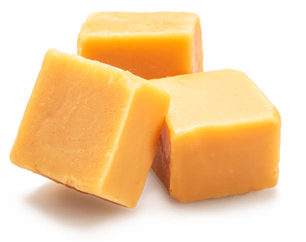 istock Caramel candies or butterscotch fudge isolated on white background. 2150928868