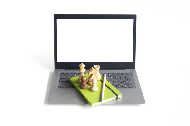 istock Chess piece on a laptop on white background 2150929465