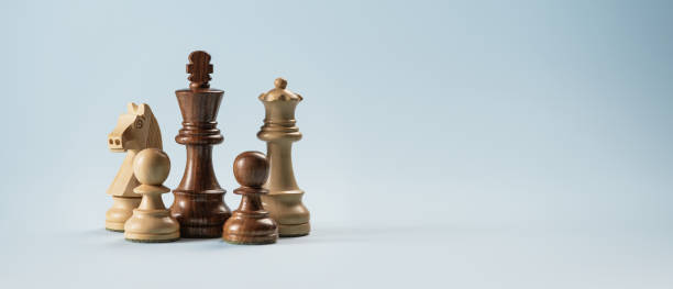 istock Wooden chess pieces and blank copy space 2150929559