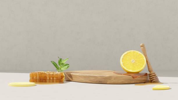 istock 3D background display stand with lemon and honeycomb are on logs for product presentation 2150929785