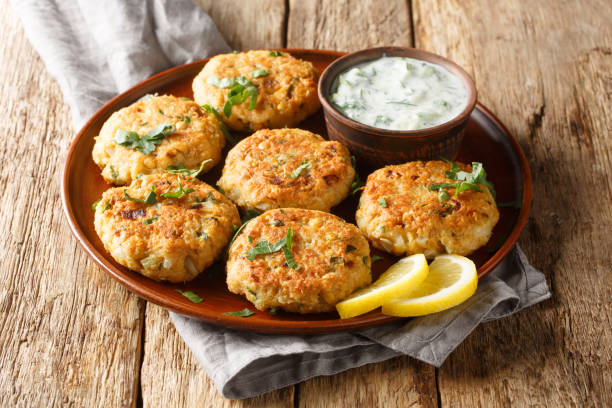 Chickpea Fritters with Yoghurt Dipping Sauce close-up in plate. Horizontal