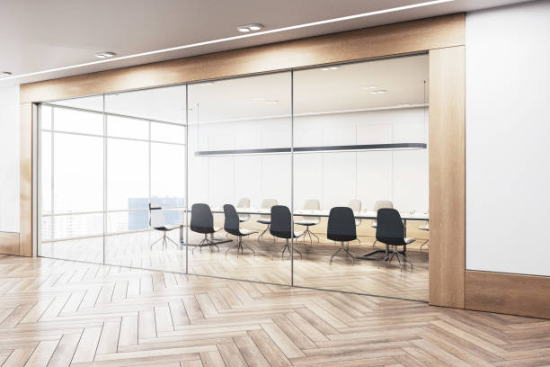istock An empty modern conference room with a long table, chairs, and panoramic windows overlooking a city, bright and spacious, concept of business meetings. 3D Rendering 2150931348