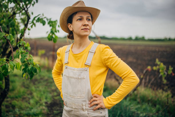 istock Woman farmer with hands on hips looking confident 2150934137