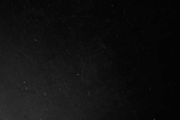 istock A black wall with scratches and scuffs as a background coating for your design with a grunge texture with scratches and gaps with space to copy 2150935200