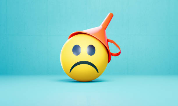 Sad face wearing a red funnel before blue background. Horizontal composition with copy space.